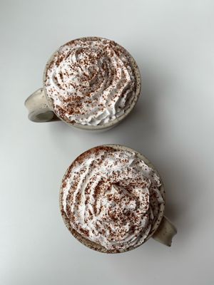 Hot chocolates with vegan whipped cream  at FIKA Dundee in Dundee