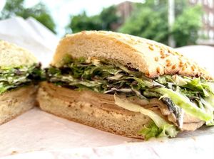 Vegan Lucille-Half 6: Vegan caesar dressing, vegan turkey, vegan parmesan, mixed greens, on toasted garlic bread.  at Babe's Corner in Lansing