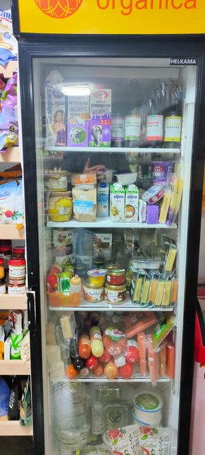 Fridge with sausages, cheese, hummus, cream at Terra Organica in Ivano-frankivsk