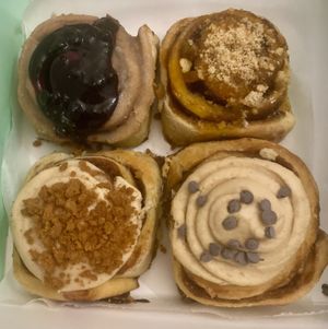 Take away box with peanut butter and blueberry, apricot crumble, speculoos and coffee with chocolate.  at Have a Roll in Antwerpen