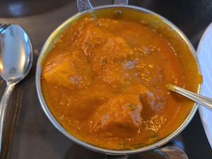 ALOO VINDALOO

Wedges of potatoes cooked with onion gravy with a touch of tomato sauce and vinegar at Taj Mahal in Terre Haute