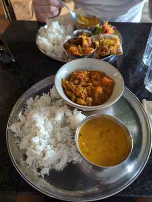 Curry dhal and Rice and the Large Thali at the back at Govinda's Cardiff in Cardiff