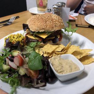 Seitan burger with vegan cheese at Govinda's Cardiff in Cardiff