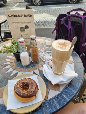 Hazelnut donut and chai tea latte at Kaffeehaus zu den Drei Herzen in Einsiedeln