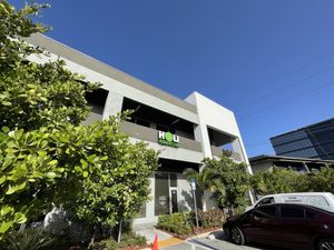 Signage from parking lot and back entrance.  at Holi Vegan Kitchen in Hallandale Beach
