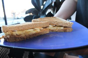 Banana & peanut butter on wheat toast with a drizzle of agave 😘 at Haus Cafe in Fair Lawn