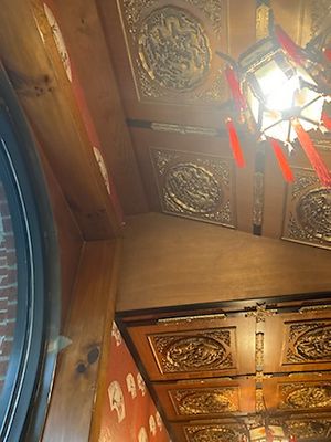 Dark wood, Chinese lanterns, and circular windows at Peking Chinese Restaurant in Wytheville