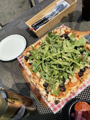 Pizza w handmade vegan cheese and stack of veggies at Stove On 스토브온 in Jeju