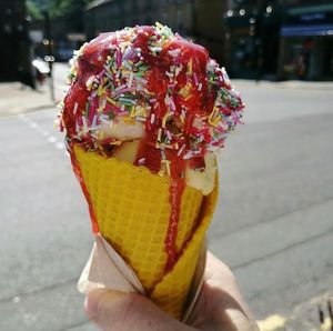 Lemon cone with caramel swirl and mango ice cream with sprinkles and strawberry sauce   at Lick in Holmfirth