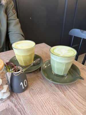 Golden turmeric latte and Japanese matcha latte with oat milk  at Rustic Cup in Whitley Bay