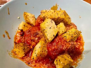 Polpette (vegan balls) with tomato sauce, and fried polenta sticks at Col Cavolo - Vegan Bistrot in Rome