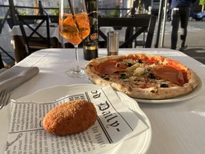 Croquette, pizza (ham, mushroom, artichoke, olive), and spritz  at La Soffitta Renovatio in Rome