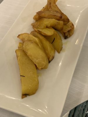 Patatas al horno (en la carta con comida de origen animal)   at La Soffitta Renovatio in Rome