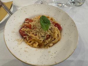 Pasta Acqua & Parina (Pasta with cherry tomatoes and vegan Parmesan)  at La Soffitta Renovatio in Rome
