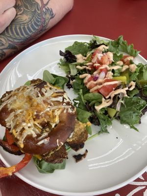 Homemade pretzel 🥨 bun sandwich and salad  at Off the Wheaten Path in Grande Prairie