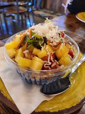 Spirulina base with peanut butter, agave, pineapple, kiwi, strawberries, and coconut shavings at Grain & Berry - Hunter Village Rd in Tampa