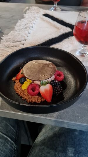 The desert of the high gin: chocolatemousse with pure chocolate on top, raspberry jam, forest fruits and a crumble on the side. at Beyond Lunchcafé & Patisserie in Nuenen