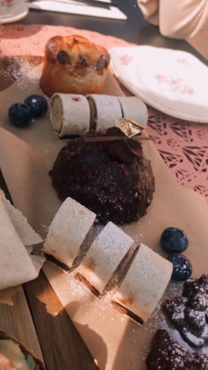 Banana chocolate ‘sushi’, peanut chocolate bites, a chocolate bombe with marmelade inside and a pear (?) cake. All vegan from their own patisserie   at Beyond Lunchcafé & Patisserie in Nuenen