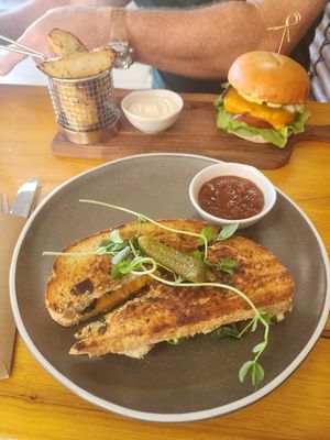 $14 cheese toastie and burger and wedges $20 or so. It was edible but bland. Bit disappointed. at Nurcha Kawana in Birtinya