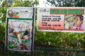 Timings written on the Sign board. at Katey's Healing Garden in Palau