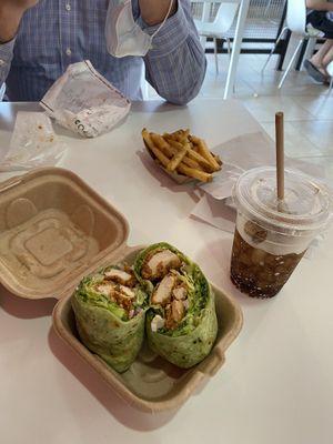 Chick’n Caesar wrap, papas, diet soda, husband eating cheeseburger 😂 at Side Chicks in San Antonio