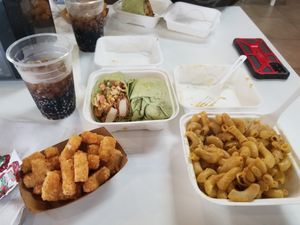 Brunch burrito, tator tots, mac n cheese, mexicane cola at Side Chicks in San Antonio