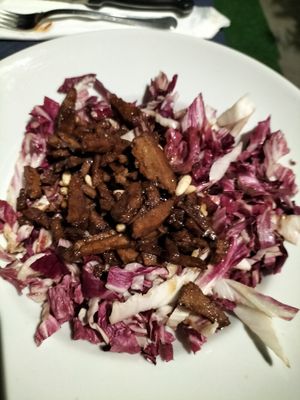 Seitan with radicchio, pine nuts, vinegar at La Tegia Di Ogni in Forli