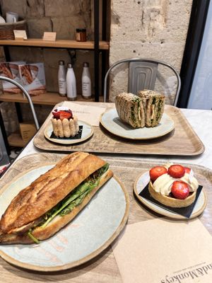 bhan mi baguette and a umami sandwich, strawberry tartlette and unsure of the other ones name  at Land & Monkeys - Amsterdam in Paris