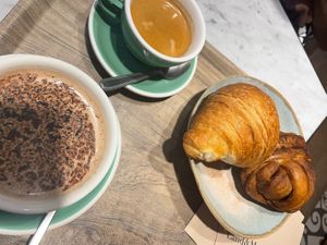 Croissant, cafe, chocolat chaud and cinnamon roll  at Land & Monkeys - Amsterdam in Paris