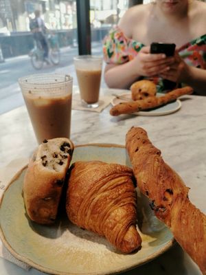 Chai Latte, Pain au chocolat, croissant, tomato bread at Land & Monkeys - Amsterdam in Paris