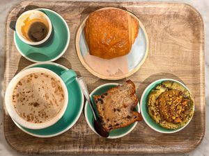 Espresso, chai latte, pain au chocolate, banana bread, pistachio cookie  at Land & Monkeys - Amsterdam in Paris