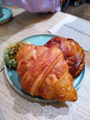 Croissant, cinnamon buns and pistachio cookie at Land & Monkeys - Amsterdam in Paris