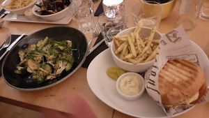 Broccoli salad and burger with fries at Spargel Kohvik in Tartu