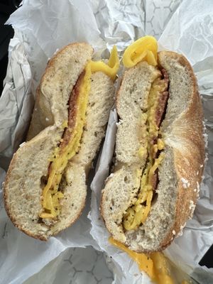 Vegan BEC with pepper and ketchup on a toasted salt bagel  at Utopia Bagels in Queens