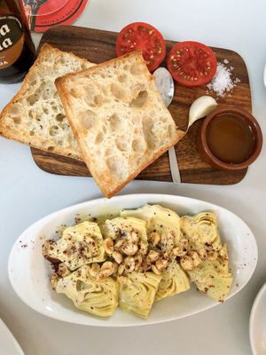 Artichokes with passion fruit dressing and hazelnuts & crystal bread   at Suquía Café in Mallorca