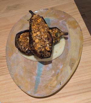 Berenjena asada pil-pil de coliflor, chimichurri y dukkah at Suquía Café in Mallorca