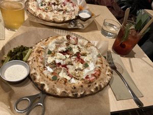 Posh pizza with Black Cherry drink  at Gemello Vegan Pizza in Berlin