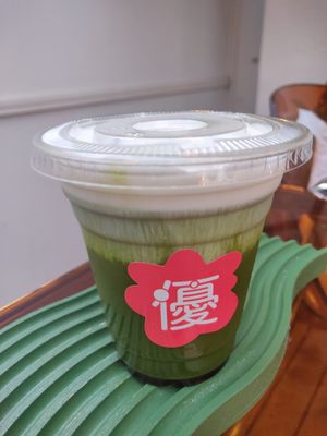 Special matcha latte with cream on top at Vegan Gyoza Yu Cafe in Tokyo