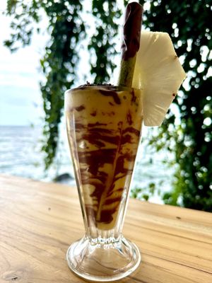 The Ometepe rainbow.. a passion pineapple smoothie with chocolate of course!!  at El Pital in Ometepe