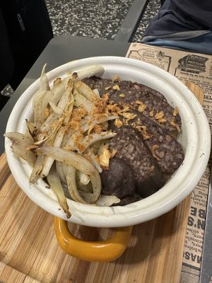 Ración de patatas confitadas con morcilla vegana  at Acherito in Jaca