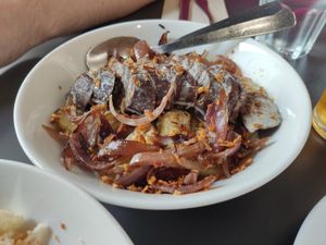 Patatas confitadas con morcilla vegana y cebolla pochada. at Acherito in Jaca