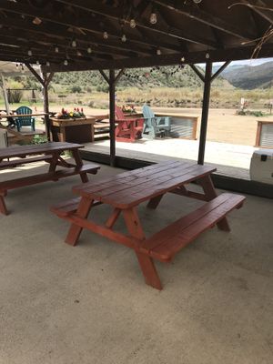 Covered seating with river view at JB's River Kitchen in Bond