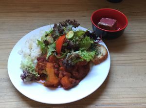 pumpkin and bean curry with salad and cake with strawberry topping  at Lentil As Anything - Footscray  in Footscray