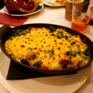 Oven baked potato gnocchi with tomato sauce, mixed vegetables and vegan cheese. at Trattoria in Bowness-on-windermere