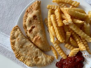 Chicken empanada, BBQ chicken empanada, fries at Poor Man Vegan in Jersey City