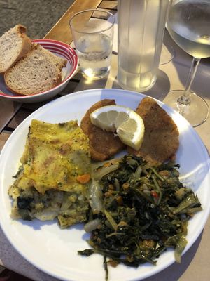 Lasagna, seitan cutlets and mixed greens  at La Cucina Dei Colori in Catania