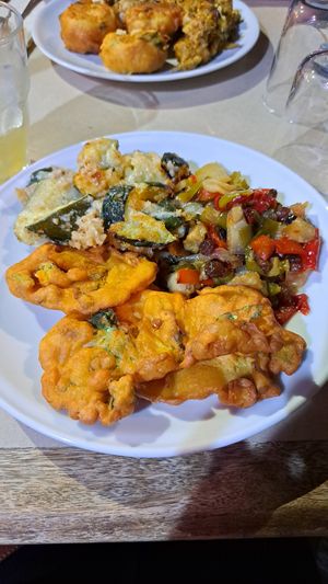 Chickpeas flour and vegetable fritters (vegan), caponata (vegan), Zucchini au gratin (vegetarian) at La Cucina Dei Colori in Catania
