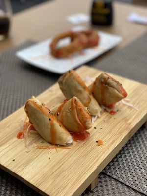 Vegetable spring rolls. In the background onion rings. at Buddha & Sakura in Calheta