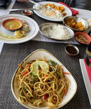 Vegi Momos, Yakisoba Noodles and cauliflower potato curryy  at Buddha & Sakura in Calheta