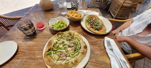 Avocado pizza and funghi flat @su casa at The House of AïA in Playa Del Carmen